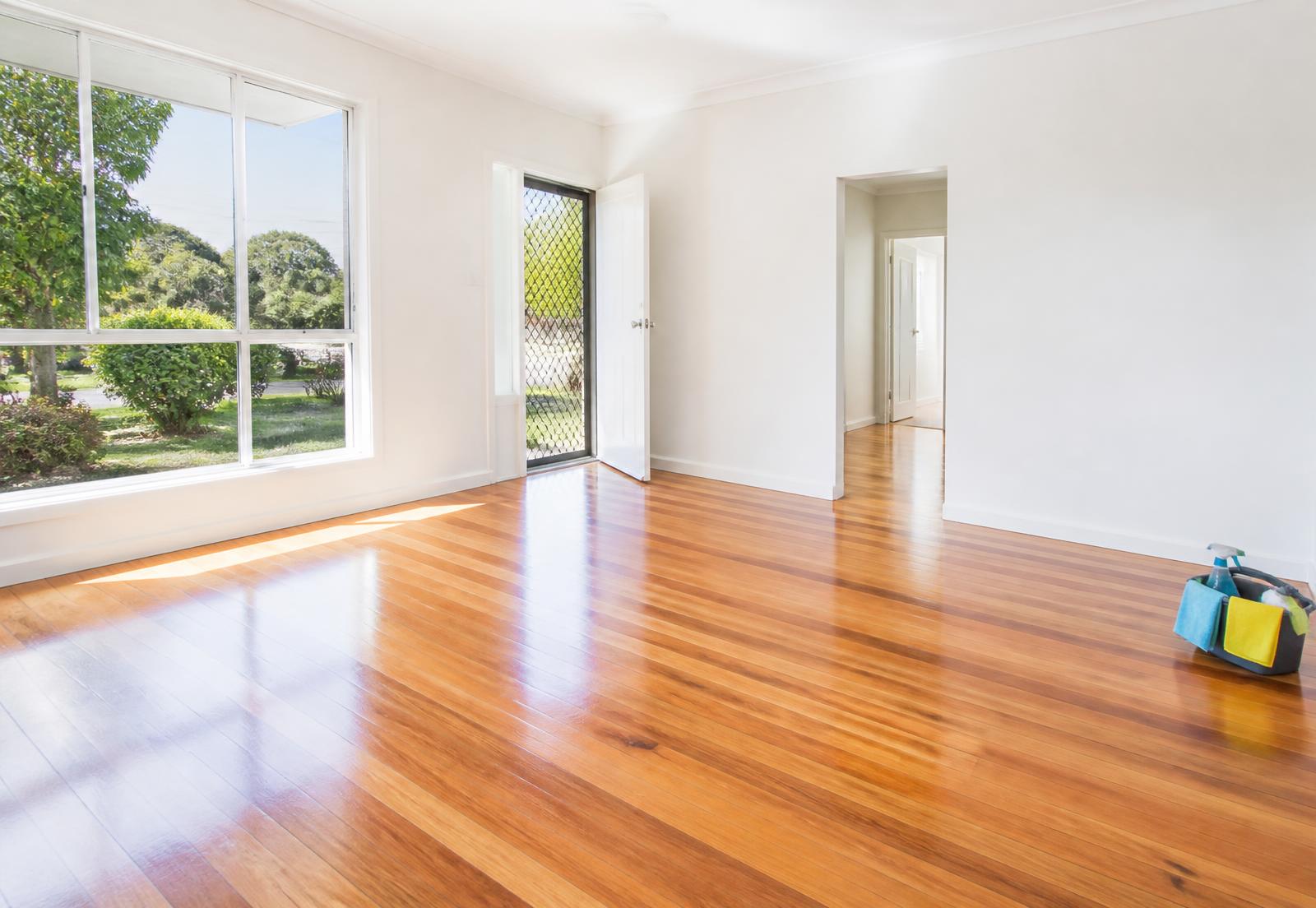 Empty Logan rental home with polished timber floors and clean windows after a bond clean